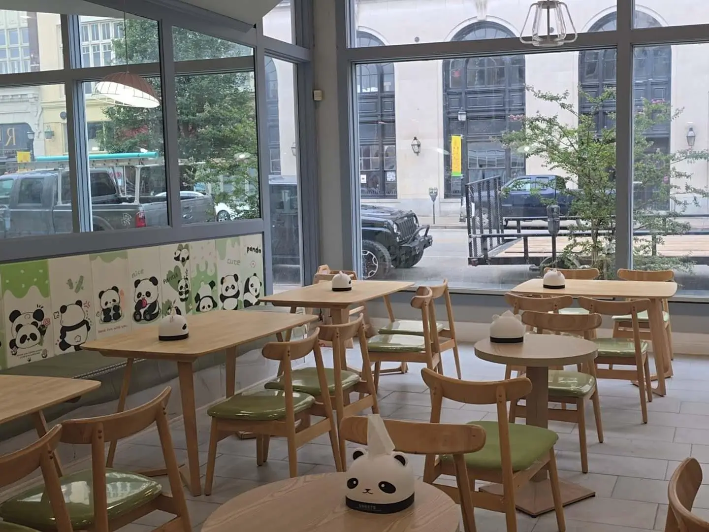 Kung-Fu-Tea-Milk-Tea-Shop-Panda-Themed-Interior-Seating-Huntington Panda - themed interior seating area with tables and chairs at Kung Fu Tea, a Milk Tea Shop in Huntington